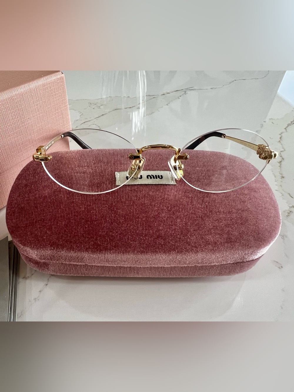 Miu Miu Gold Rimless Glasses with Tortoiseshell Temples and Pink Case